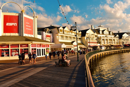 Orlando, Florida; November 12, 2018 People walking and sport bar on charming boardwalk in Lake Buena Vista area.のeditorial素材