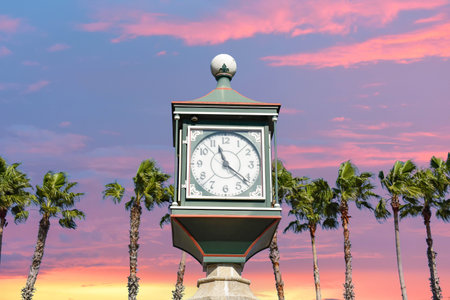 St. Augustine, Florida. January 26, 2019. Vintage watch on colorful sunset sky background in Floridas Historic Coastのeditorial素材