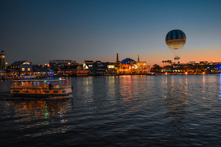 Orlando, Florida. January 11, 2019 Colorful dockside, air balloon and water taxi on sunset background in Lake Buena Vista area.のeditorial素材