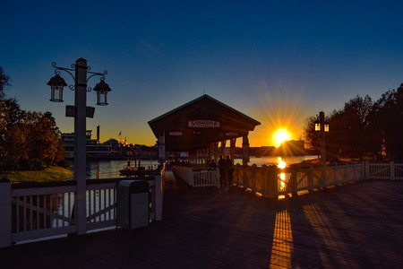 Orlando, Florida. January 11, 2019 Orlando, Florida. September 29, 2018. Streetlight and Wharf of Water taxis on colorful sunset in Lake Buena Vista area.のeditorial素材