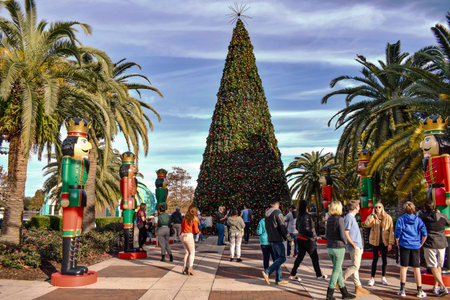Orlando, Florida . December 24, 2018. People taking pictures with Christmas tree and nutcrackers in...