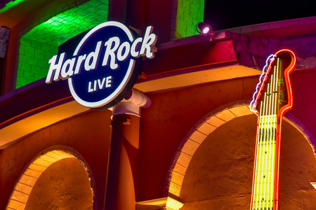 Orlando, Florida. February 05, 2019. Hard Rock Live sign and partial view of guitar on colorful building background in Citywalk at Universal Studios area.のeditorial素材