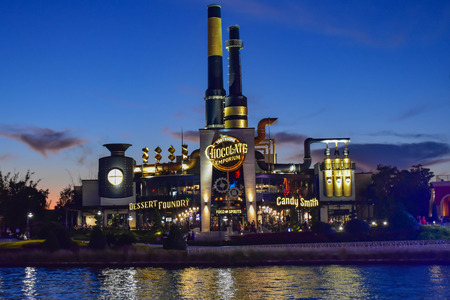 Orlando, Florida. February 05, 2019. Chocolate Emporium Restaurant on blue night background in Citywalk at Universal Studios area.のeditorial素材