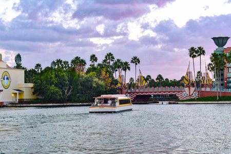Orlando, Florida. February 09, 2019 Taxi boat sailing on lake on cloudy sky background at Lake Buena...