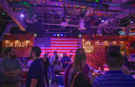 Orlando, Florida. January 19, 2019. People enjoying midnight in colorful american bar in...