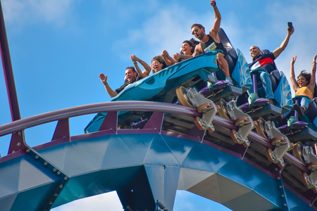 Orlando, Florida . February 17, 2019 People enjoying Mako Rollercoaster on lightblue cloudy sky background in International Drive area (7)のeditorial素材