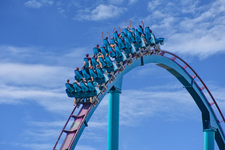 Orlando, Florida . February 17, 2019 People enjoying Mako Rollercoaster on lightblue cloudy sky background in International Drive area (6)のeditorial素材