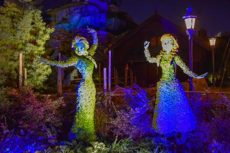 Orlando, Florida . March 27, 2019. Frozen Elsa and Ana illuminated topiaries on beautiful scenery at Epcot in Walt Disney World (2)のeditorial素材