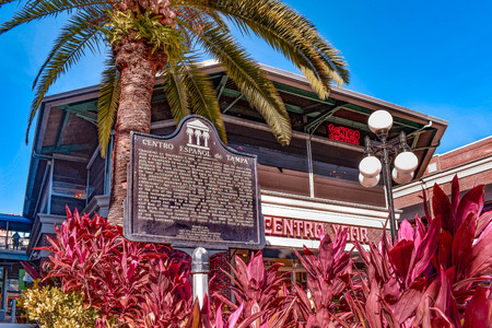 Ybor City Tampa Bay, Florida. January 19, 2019 Spanish Center sign and colorful plants on 7th Ave.のeditorial素材