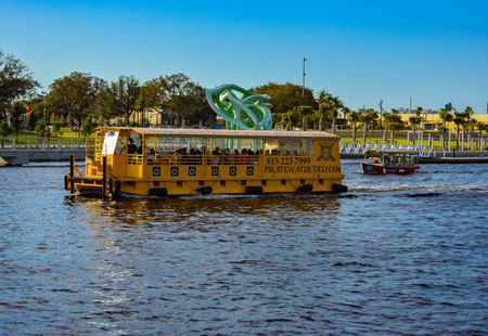 Tampa Bay, Florida. March 02, 2019 Water tax and nice boat sailing on Hillsborough river in downtown area.のeditorial素材