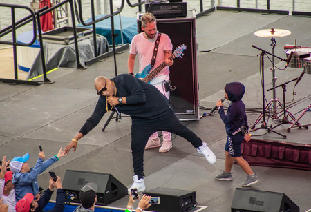 Orlando, Florida. March 17, 2019. Alexander Delgado touches the hand of a boy, during the recital of Zone People at Seaworld in International Drive Area.のeditorial素材