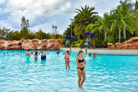 Orlando, Florida. April 07, 2019. People enjoying a pool on the tropical background at Aquatica water park (2)のeditorial素材