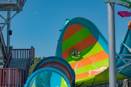 Orlando, Florida. May 20, 2019 People having fun Karekare curl. This new ride is a curve shaped wave which will riders experience when climbing the vertical wave wall at Aquatica (6)のeditorial素材