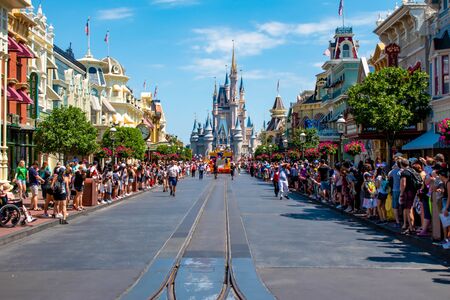 Orlando, Florida. May 16, 2019. Orlando, Florida. April 02, 2019. Colorful dancers in Mickey and Minnie's Surprise Celebration on lightblue sky background at Walt Disney World (12)のeditorial素材