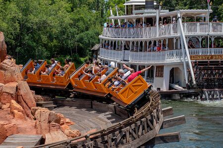 Orlando, Florida. May 10, 2019. Big Thunder Mountain railroad and Liberty Square Riverboat in Magic Kingdom at Walt Disney World.のeditorial素材