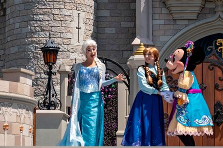 Orlando, Florida. May 17, 2019. Elsa, Anna and Minnie on Mickey's Royal Friendship Faire on Cinderella Castle in Magic Kingdom at Walt Disney World Resort (1)のeditorial素材