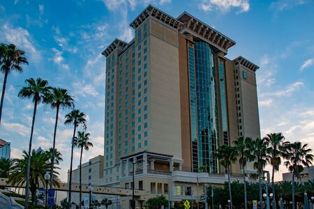 Tampa Bay, Florida. April 28, 2019. Embassy Suites Convention Center on lightblue sky cloudy background.のeditorial素材