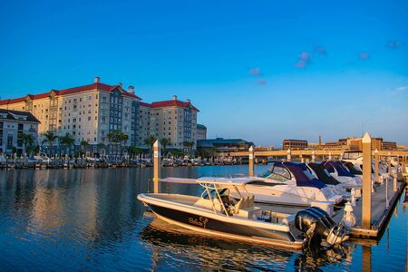Tampa Bay, Florida. April 28, 2019 Luxury boats and Harbor Island on lightblue sky background.のeditorial素材