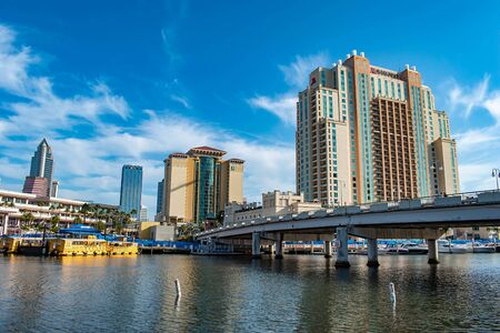 Tampa Bay, Florida. April 28, 2019. S Harbor Island Blvd bridge, Embassy Suites, Convention Center and taxi boat on Hillsborough riverのeditorial素材