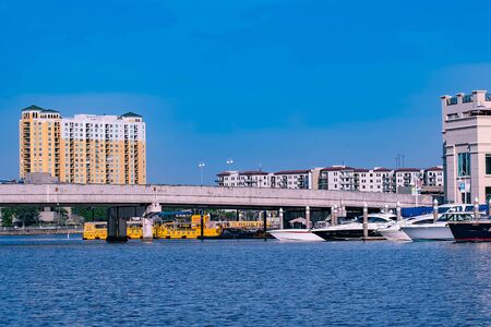 Tampa Bay, Florida. April 28, 2019. S Harbor Island Blvd bridge, luxury and taxi boats.のeditorial素材
