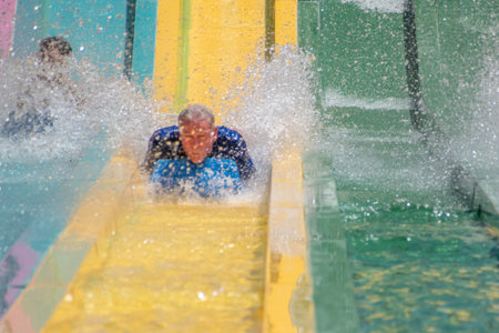 Orlando, Florida. July 01, 2019. People having fun in Taumata Racer attraction at Aquatica. It is...