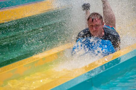 Orlando, Florida. July 01, 2019. Person enjoying amazing splashing in Tamauta Racer attraction at Aquatica 12のeditorial素材
