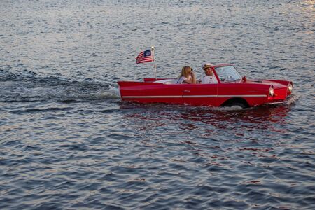 Orlando, Florida. June 15, 2019. People enjoying ride in vintage red amphicar at Disney Springs 2のeditorial素材