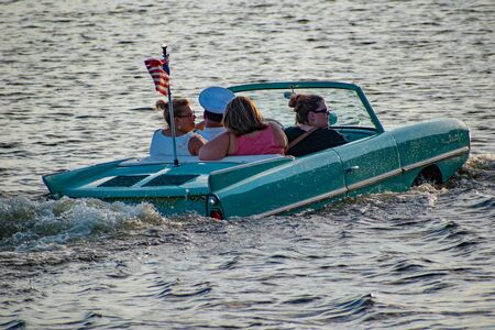 Orlando, Florida. June 15, 2019. People enjoying ride in vintage red amphicar at Disney Springs 3のeditorial素材
