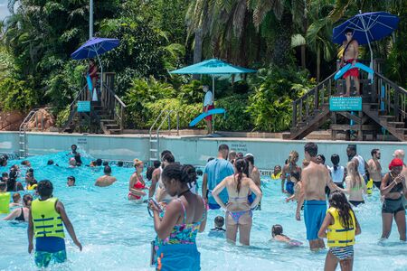 Orlando, Florida. July 28, 2019. People enjoying pool with waves at Aquatica 3のeditorial素材