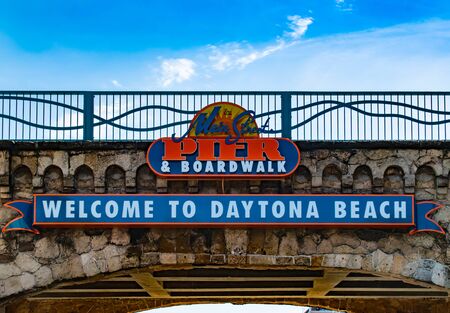 Daytona Beach, Florida. July 06, 2019 Top view of Welcome to Daytona Beach and Pier AND Boardwalk sign.のeditorial素材
