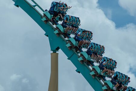 Orlando, Florida. July 26, 2019. People having fun Kraken rollercoaster during summer vacation at Seaworld 4のeditorial素材