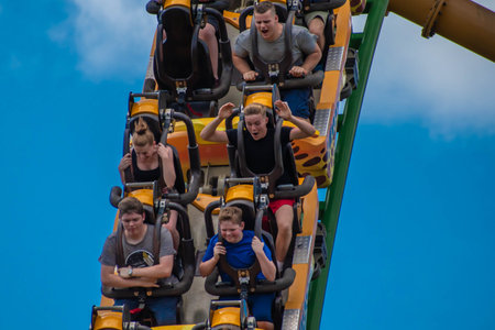 Tampa Bay, Florida. August 08, 2019. People amazing terrific Cheetah Hunt rollercoaster on lightblue...