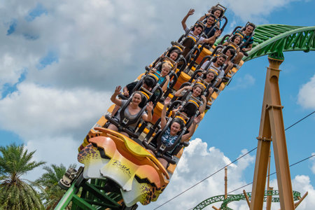 Tampa Bay, Florida. August 08, 2019. People having fun terrific Cheetah Hunt rollercoaster on...