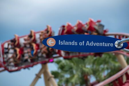 Orlando, Florida. August 07, 2019. Island of Adventure sign and Hollywood Rip Ride Rockit rollercoaster at Universal Studios 23のeditorial素材