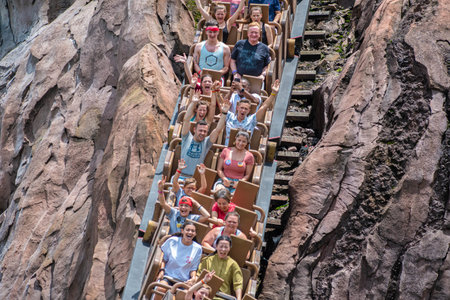 Orlando, Florida. August 14, 2019. People having fun terrific Expedition Everest rollercoaster at...