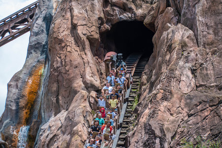 Orlando, Florida. August 14, 2019. People having fun terrific Expedition Everest rollercoaster at...