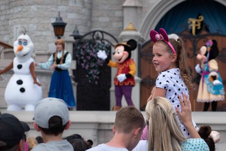 Orlando, Florida. September 25, 2019. Nice little girl enjoying Mickeys Royal Friendship Faire on Cinderella Castle in Magic Kingdom at Walt Disney World Resort (1)のeditorial素材
