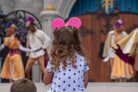 Orlando, Florida. September 25, 2019. Nice little girl enjoying Mickeys Royal Friendship Faire on Cinderella Castle in Magic Kingdom at Walt Disney World Resort (2)のeditorial素材