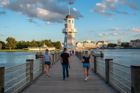 Orlando, Florida. October 11, 2019. People walking on pier on the way to lighthouse at Lake Buena Vista 1のeditorial素材