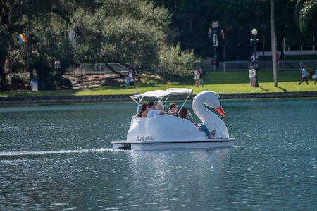 Orlando, Florida. October 12, 2019. Friends having fun swan boat in downtown area 14のeditorial素材