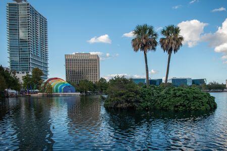 Orlando, Florida. October 12, 2019. Panoramic view of little island with palms and Walt Disney Amphitheater on Lake Eola Park at downtown area 2のeditorial素材