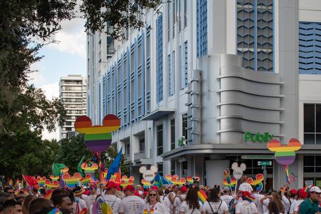 Orlando, Florida. October 12, 2019. Faces of Pride by Marriott sign in Come Out With Pride Orlando parade at Lake Eola Park area 174のeditorial素材