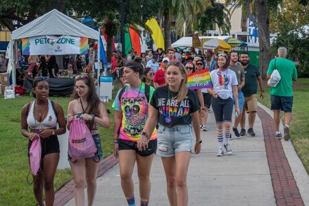 Orlando, Florida. October 12, 2019. Lesbian couple walking Lake Eola Park area 110のeditorial素材