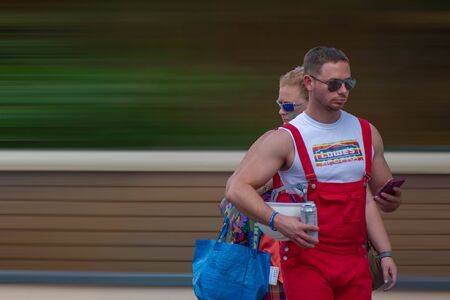 Orlando, Florida. October 12, 2019. Man with his mother in Come Out With Pride Orlando parade at Lake Eola Park area 129のeditorial素材