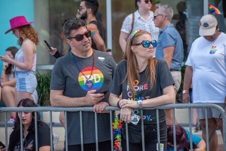 Orlando, Florida. October 12, 2019. Nice couple waiting for the beginning of the parade in Come Out With Pride Orlando at Lake Eola Park area 3のeditorial素材