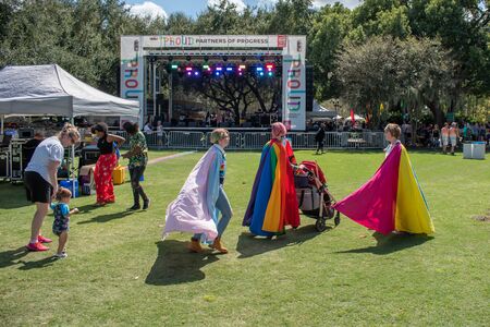 Orlando, Florida. October 12, 2019. Nice girls with colorful flags in Come Out With Pride Orlando parade at Lake Eola Park area 171のeditorial素材