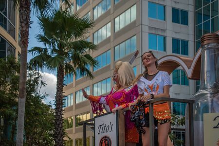 Orlando, Florida. October 12, 2019. Nice woman and trans in Titos chariot at Come Out With Pride Orlando parade 2のeditorial素材