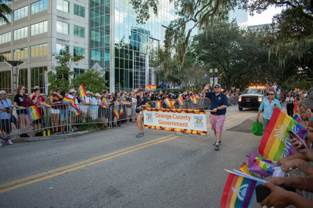 Orlando, Florida. October 12, 2019. Orange County Government sign in Come Out With Pride Orlando parade at Lake Eola Park area 1のeditorial素材