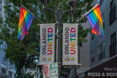 Orlando, Florida. October 12, 2019. Orlando United signs and rainbow flags in Come Out With Pride Orlando parade at Lake Eola Park area 1のeditorial素材