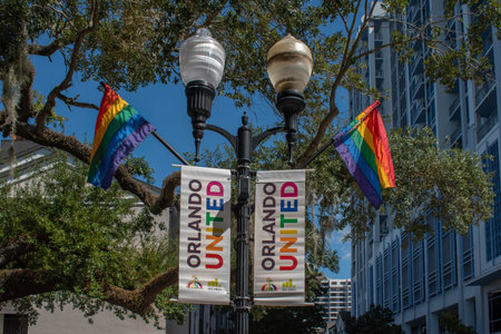 Orlando, Florida. October 12, 2019. Orlando United signs and rainbow flags in Come Out With Pride Orlando parade at Lake Eola Park area 2のeditorial素材